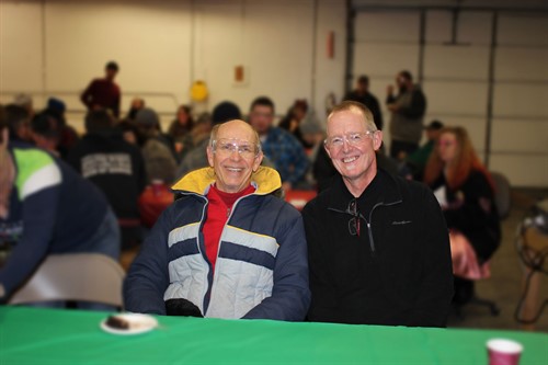 Bruce With Roger Mcmillan At Christmas Dinner Blurred Background